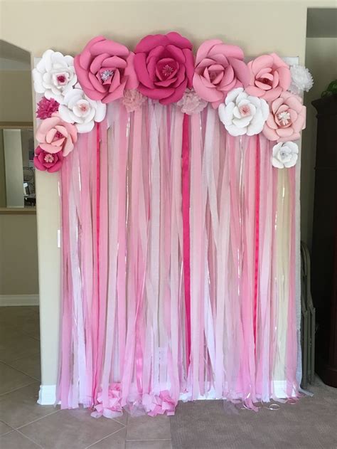 They tie in all of the decorations together to look unified and balanced. Photo backdrop for a girl baby shower | Diy baby shower ...