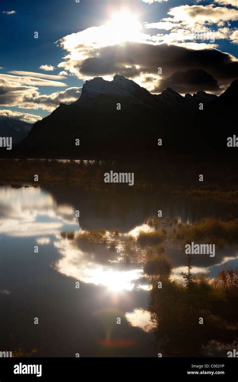 Mountain Range Reflected On Still Lake Sunrise At Vermillion Lakes