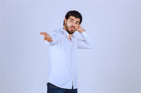 Free Photo Man In White Shirt Trying To Explain Himself