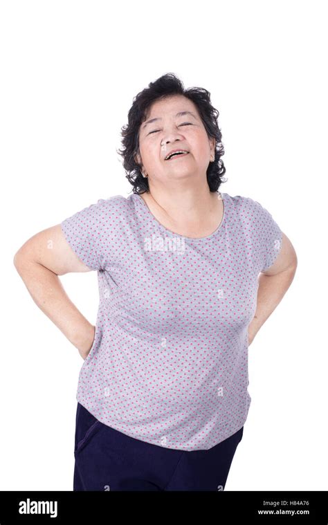 Asian Elderly Woman With A Sick Back Backache Isolated On A White