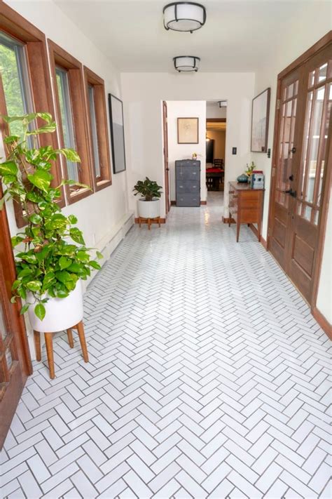 Entryway with Handmade Tile Floor in Herringbone ... This is a time lapse of a 4x12 marble tile installed on a herringbone pattern with border tile of the same size.