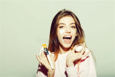 Happy Pretty Girl Putting Facial Cream Or Mask On Face Stock Image Image Of Adorable Smiling