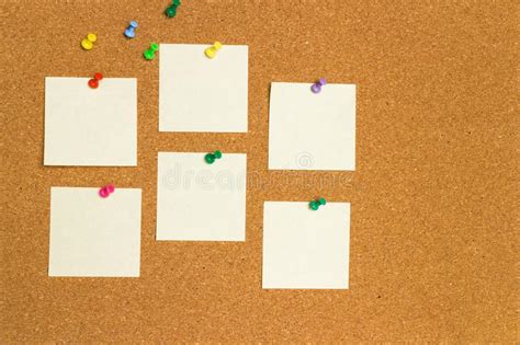 Empty Yellow Sticky Notes On Cork Board With Color Pins Stock Image