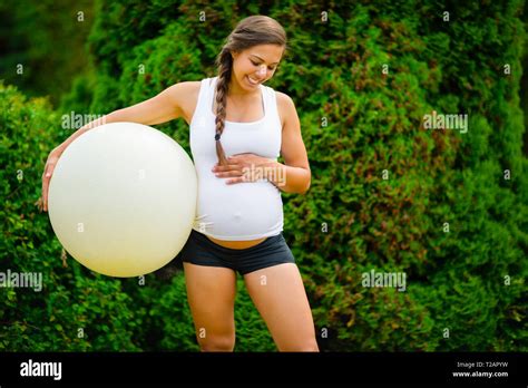 Pregnant Touching Belly Hi Res Stock Photography And Images Alamy