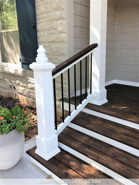 This handrail is easy to install and is much sturdier than plastic or wrought iron railings. My Finished Front Porch Steps And Railings - Addicted 2 Decorating®