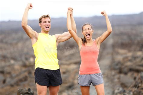 Cheering Celebrating Happy Fitness Runner Couple Stock