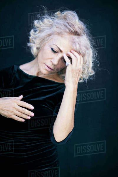 Close Up Of Woman Touching Her Forehead Stock Photo Dissolve