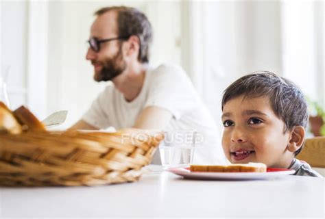 Boy Sitting At Dinner Table — Dining Room Cheerful Stock Photo