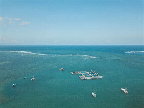 Aerial View Of Seascape Against Blue Sky Bali Indonesia Stock Photo