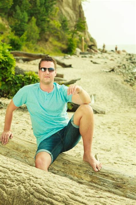Handsome Man Relaxing On Beach During Summer Stock Photo Image Of