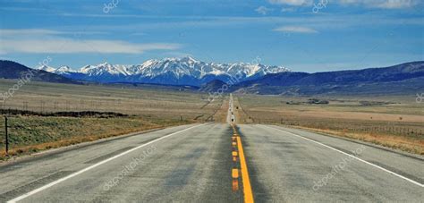 Road Into Mountains Stock Photo By ©nyker 43451643