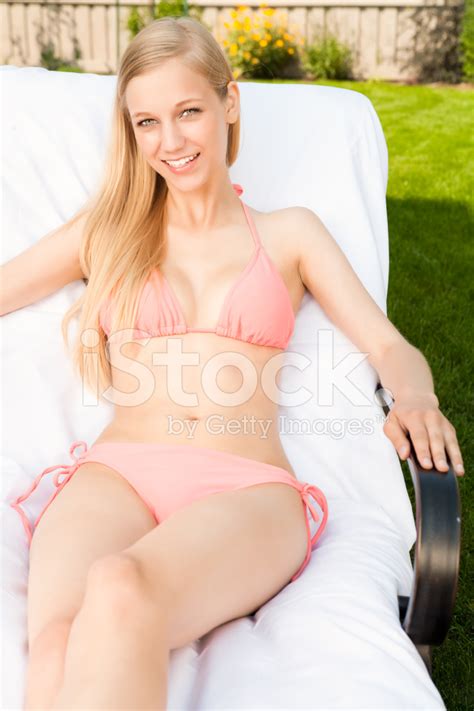Smiling Female Sunbathing In Backyard Stock Photo Royalty Free