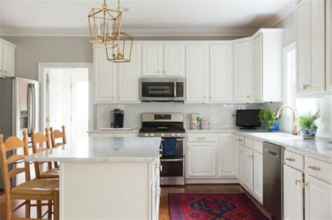 Made from mango wood and mdf material, each wall decor features a modern design in black and white hues that creates a transitional look. The Perfect Gray Wall Color | Laura Trevey Home Makeover