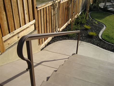 Outdoor stone steps and iron railing. Exterior Wrought Iron Railing Sacramento, Wrought Iron Railing