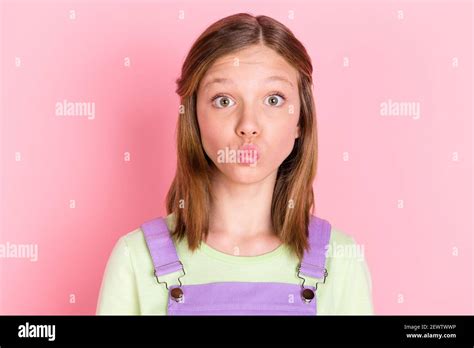 Photo Portrait Of Small Girl Sending Air Kiss With Pouted Lips Staring