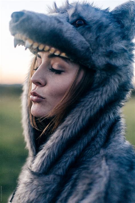 Sultry Woman Makes A Sexy Face In A Wolf Costume By Stocksy