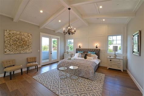Traditional Master Bedroom With Carpet Cathedral Ceiling Crown Molding Hardwood Floors