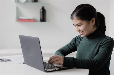 Happy Woman On Computer4460x4460 Information Systems Corporation
