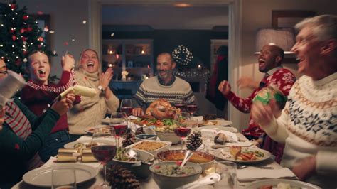 Kids sitting at christmas table with father. Happy Family Christmas Dinner Party Stock Footage Video (100% Royalty-free) 1033939973 ...