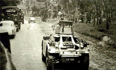 Army Armoured Ferret Scout Car On Road Patrol Through Rubber Estates