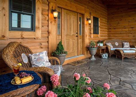 Wicker Furniture Provides Comfortable Seating For Guests On This Log