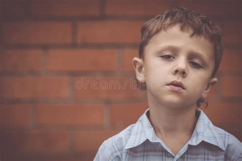 Portrait One Sad Little Boy Standing Near A Wall Stock Photo Image Of
