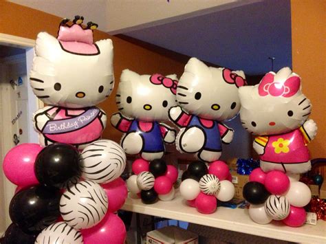 Some Hello Kitty Balloons Are On A Table