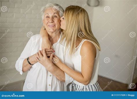 Granddaughter Kissing Grandmother In The Room Stock Image Image Of Generation Kissing 111117339