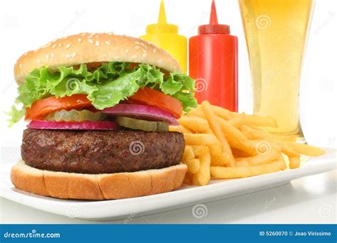 Hamburger French Fries Ketchup Mustard And Beer Stock Photo Image