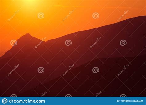 A Beautiful Minimalist Landscape During The Sunrise Over Mountains In