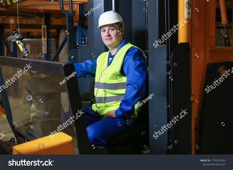 Forklift Driver Warehouse Looks Camera Stock Photo 1774722695