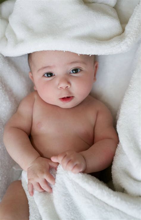 Download Baby Photography Wrapped In White Towel Wallpaper