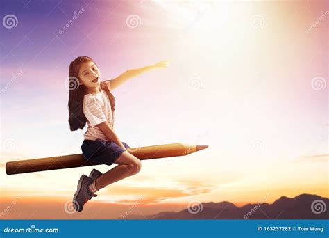 Happy Little Girl On Pencil And Flying In The Sky Stock Photo Image