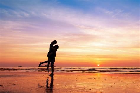 Premium Photo Couple Kissing On The Beach With A Beautiful Sunset In