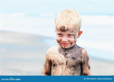Happy Dirty Child Having Fun On Black Sand Beach Stock Photo Image Of