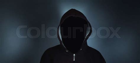 Faceless Man In Hoodie Standing On Dark Background Stock Image Colourbox