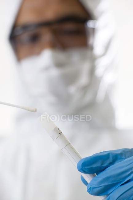 Forensic Scientist Putting Swab Into Sample Tube Hand Man Stock