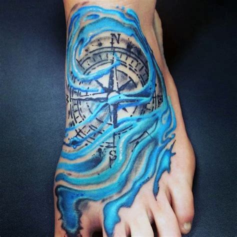 Detailed Compass And Pale Blue Water Waves Foot Tattoo Tattooimages Biz