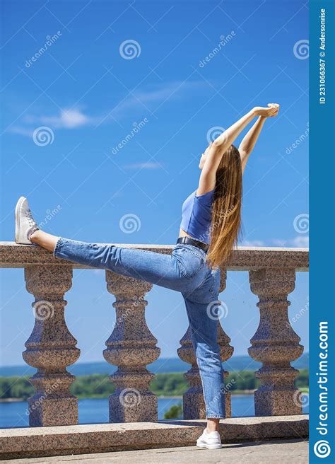 Young Beautiful Blonde Girl In Blue Jeans Summer Park Outdoors Stock