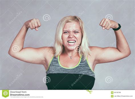 Strong Muscular Sporty Woman Flexing Muscles Stock Photo
