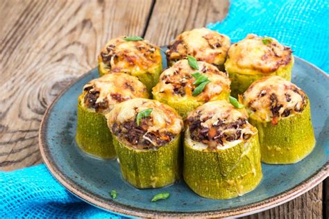 Zucchini Stuffed With Meat And Cheese On Blue Plate Stock Photo Image
