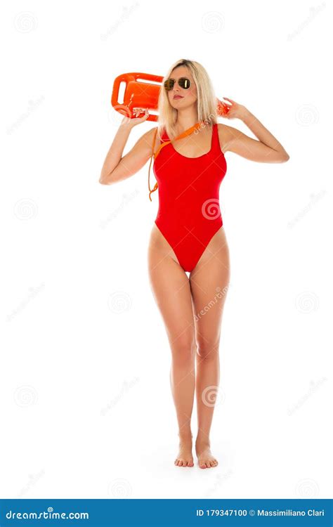 Pretty Young Blonde Lifeguard In Red Swimsuit With Lifeguard Rescue Can