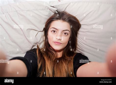 Teenage Year Old Girl Posing For A Pretend Selfie In Her Bedroom