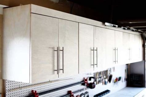 We have a full line of storage systems that hang on a slat wall system. Wall Mounted Garage Cabinets - Free Woodworking Plan.com