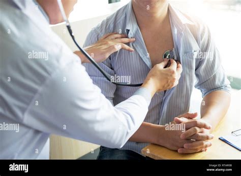 Doctor Is Checking On Patients Chest Uses Stethoscope To Listen