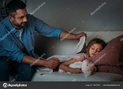 Father Covering Sleeping Daughter Blanket — Stock Photo © Igorvetushko