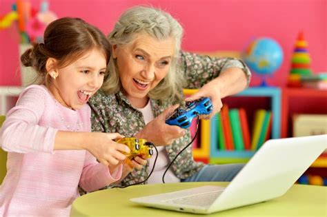 Granny With Her Grandbabe Playing Computer Gam Stock Photo Image SexiezPicz Web Porn