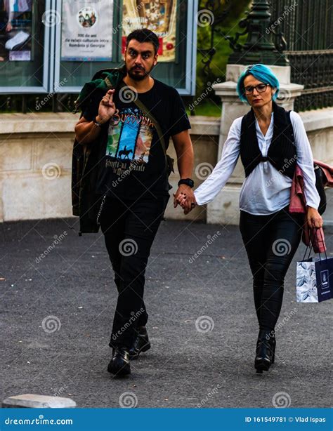 People Tourists Walking On The Sidewalk In Downtown Bucharest Romania