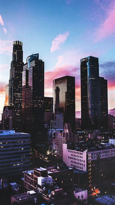Download Aesthetic City Under Vivid Retro Sky Wallpaper