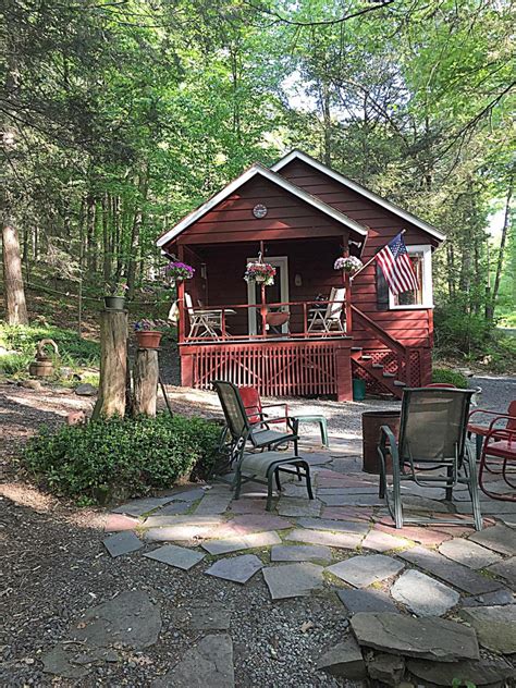 Book your holiday cabin in pocono mountains. Front of house at our quaint house for rent in Lake ...
